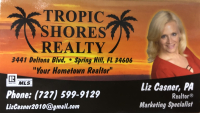 tropic shores realty with liz casner's headshot- a blond white smiling woman