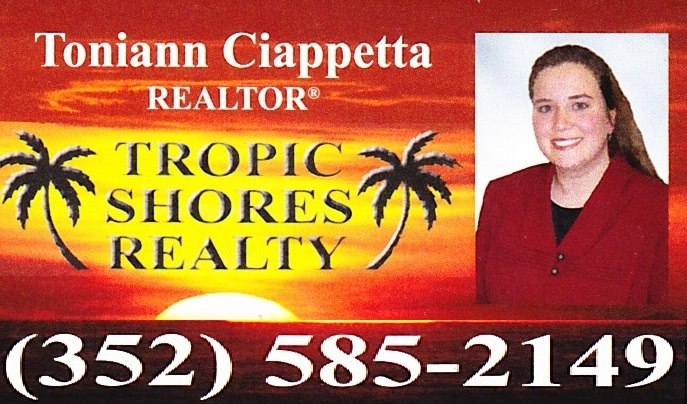 tropic shores realty logo with toniann's headshot- a smiling blond white woman